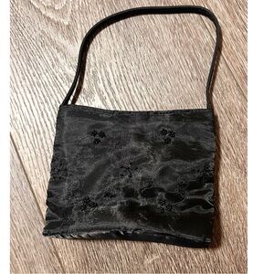 Claire’s Small black purse with beaded flower detailing
